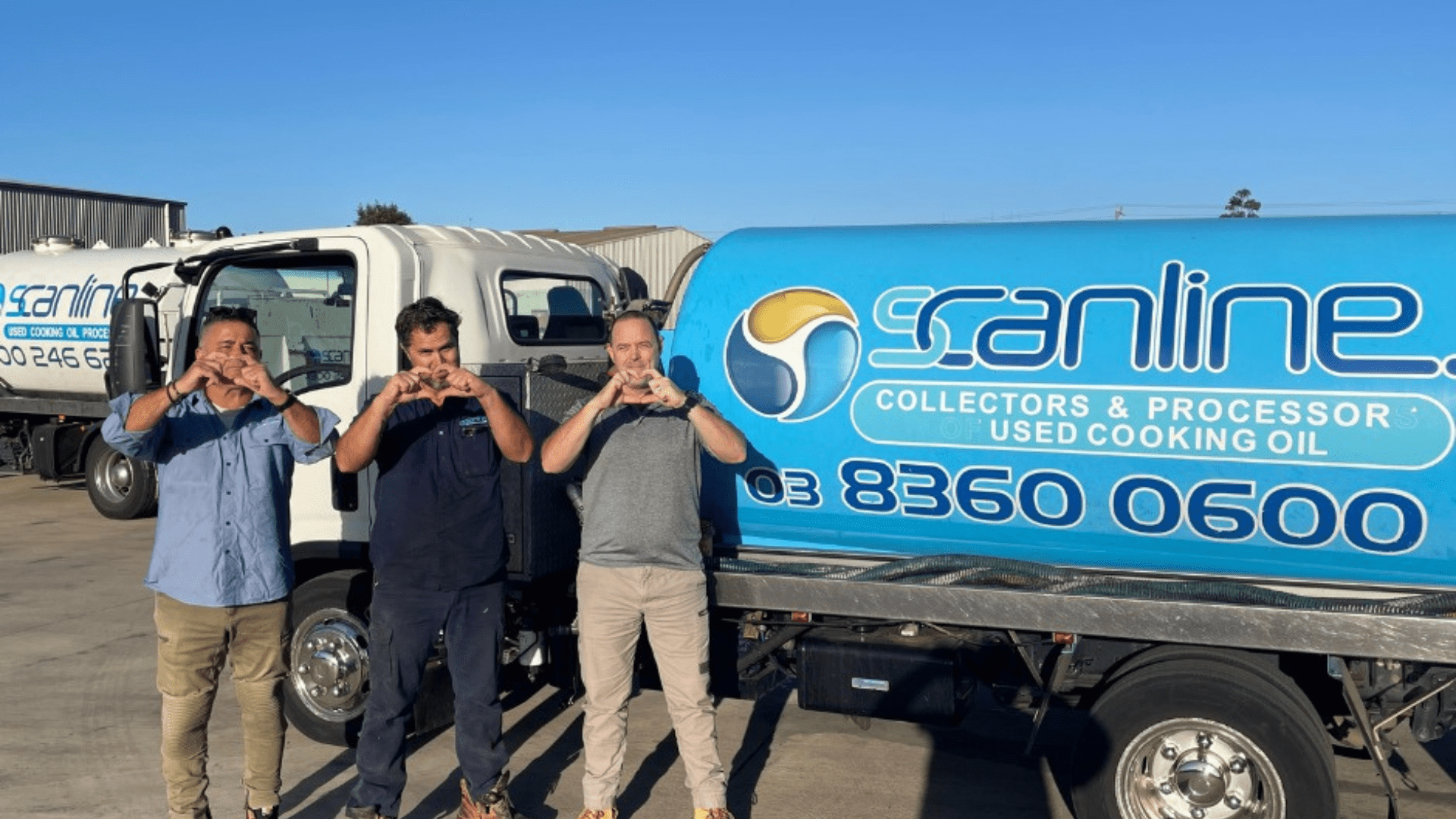 Scanline staff in front of Scanline truck with hands symbolising a heart